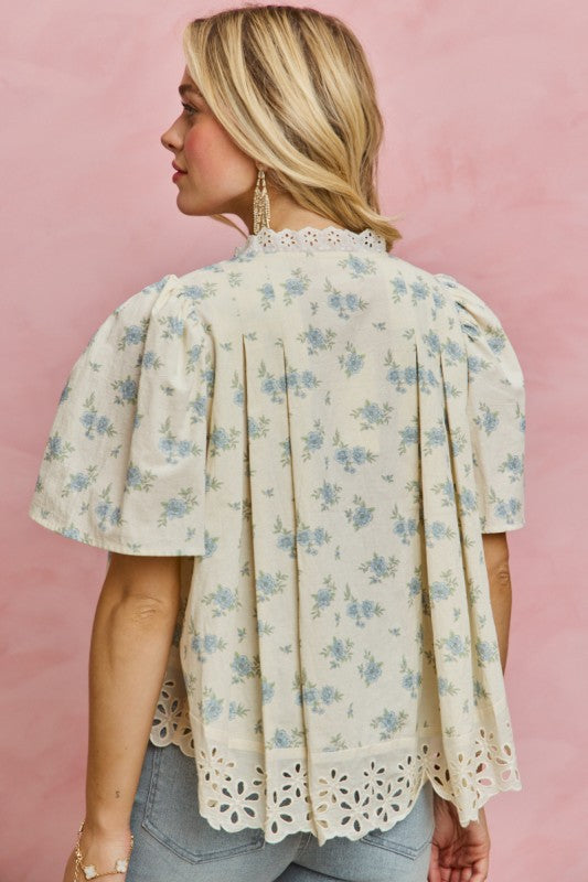 Back view of flowy vintage floral blouse with lace trim