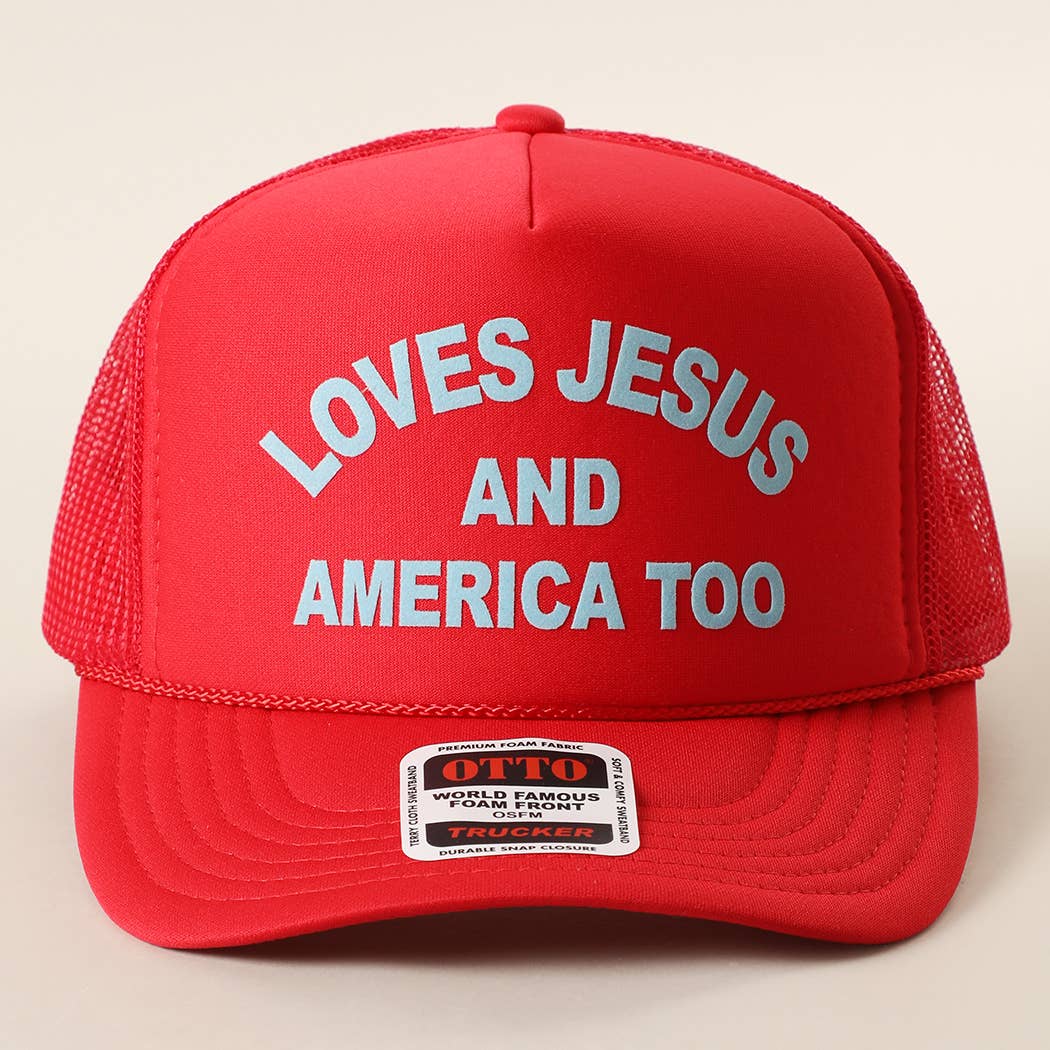 Red foam trucker hat featuring the phrase Loves Jesus and America Too with a breathable mesh back and adjustable snapback closure.