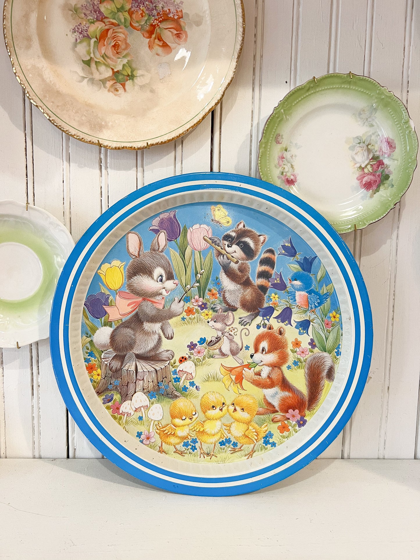 Children's plate with animal design on a wooden surface