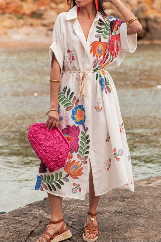 Spanish-inspired embroidered floral dress with tie waist. Perfect for summer vacations, fiestas, and boho coastal style.