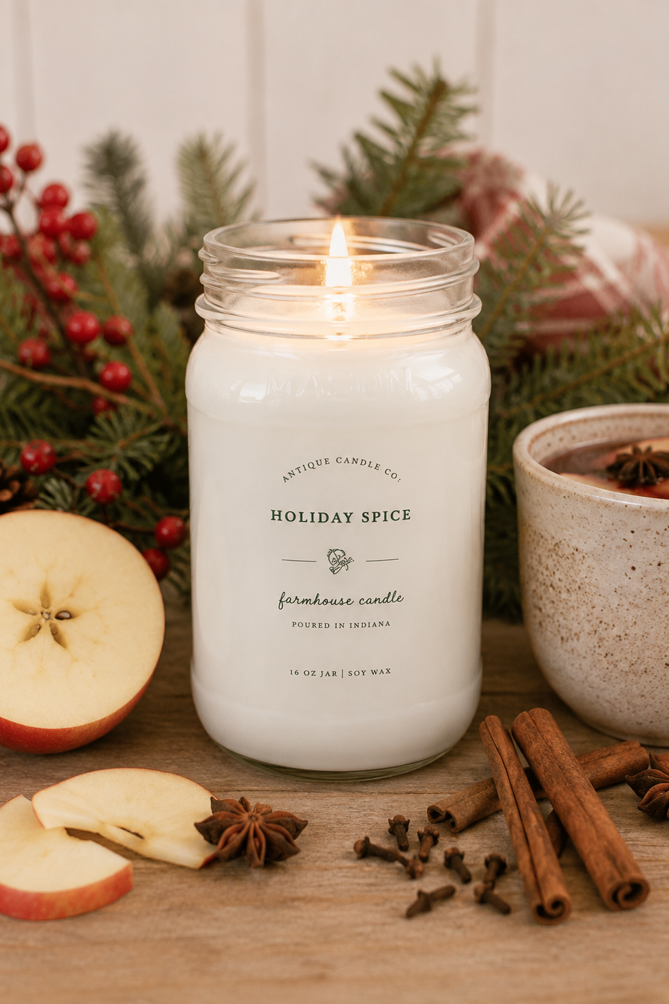 Antique Candle Co. Holiday Spice 16 oz soy candle with red apple, orange peel, cinnamon, clove, nutmeg, ginger and vanilla sugar fragrance.