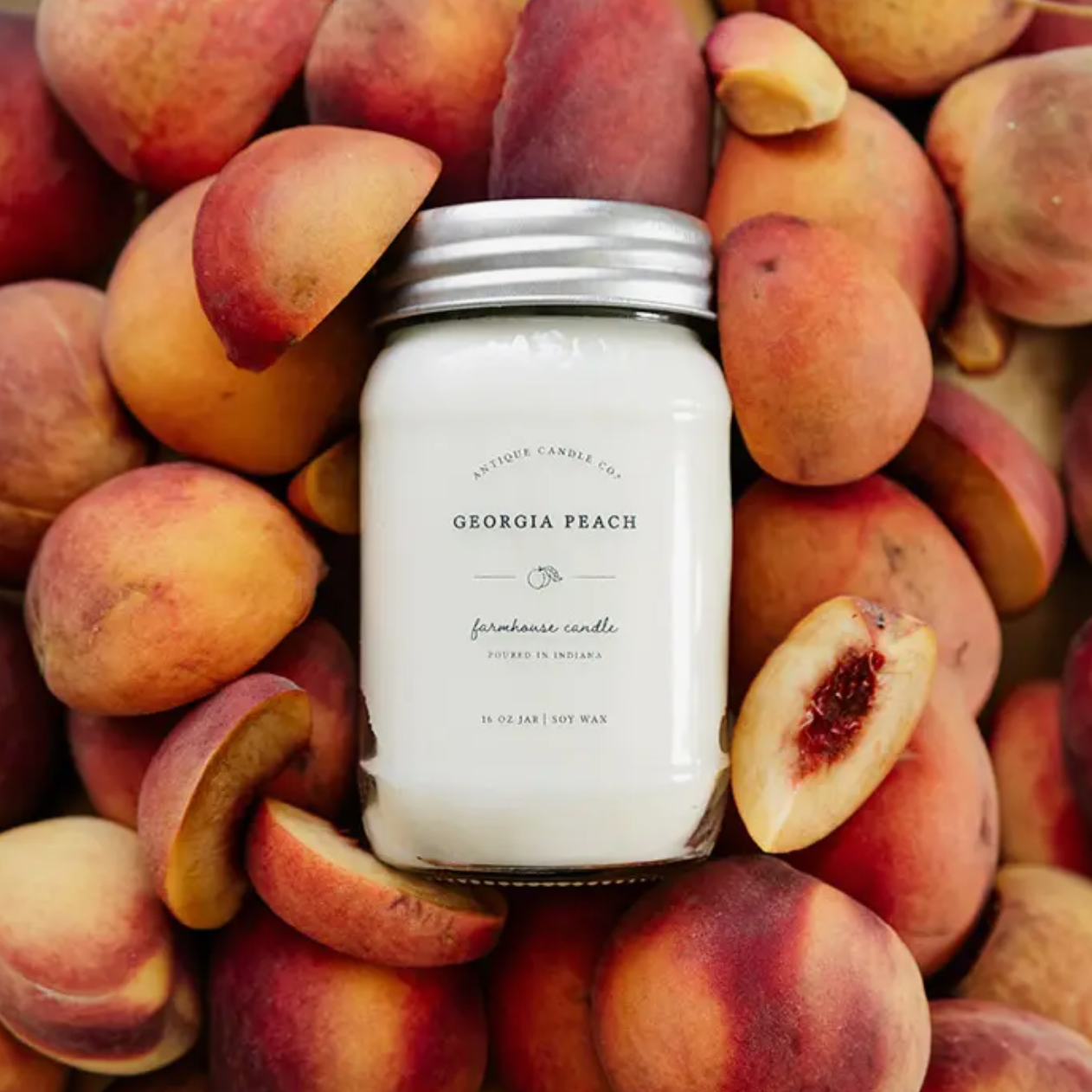Georgia Peach soy candle customer review graphic over fresh peach background highlighting fruity summer scent.