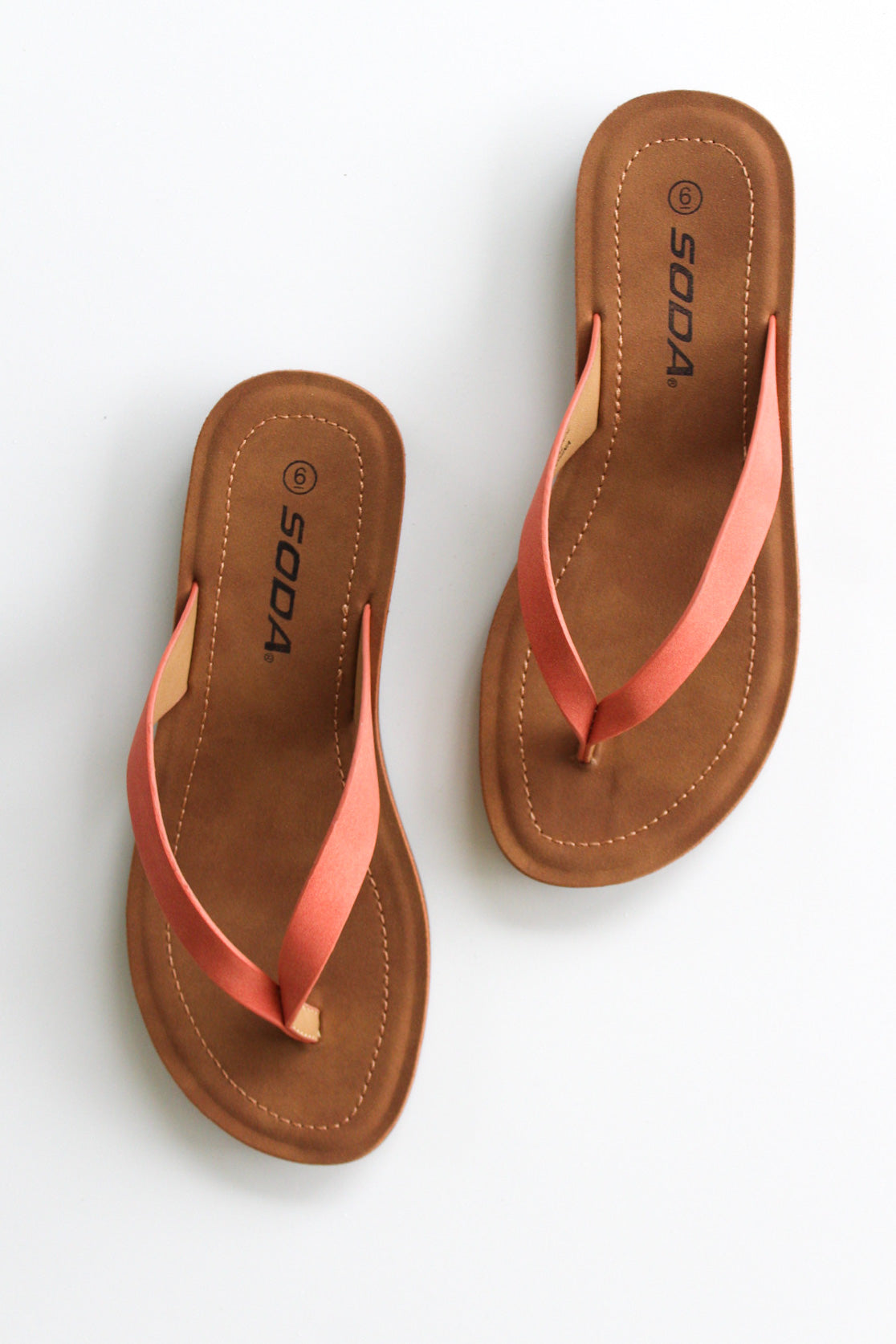 Coral flip flop sandals.