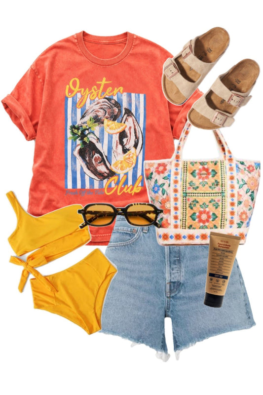 Collection of summer clothing and accessories including a graphic t-shirt, shorts, sandals, and a tote bag on a white background.