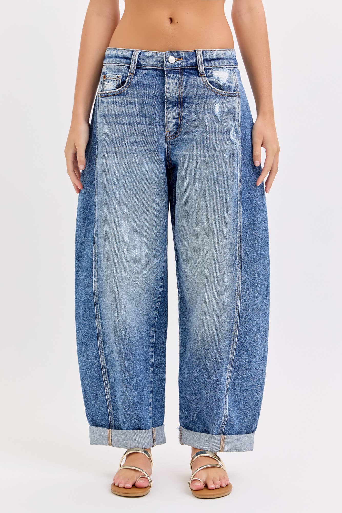 Wide-leg barrel jeans worn by a person on a white background