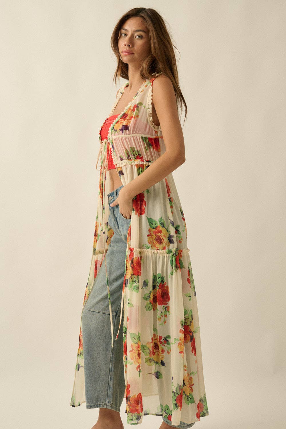 Woman wearing a floral dress with a plain background