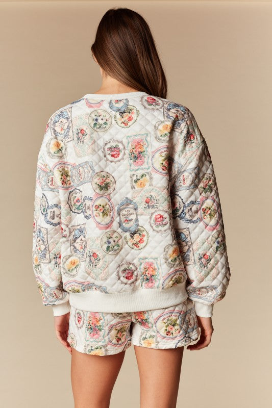 Person wearing a floral patterned outfit on a beige background