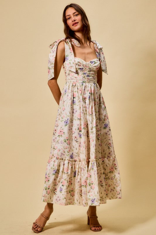 Woman wearing a floral dress against a beige background