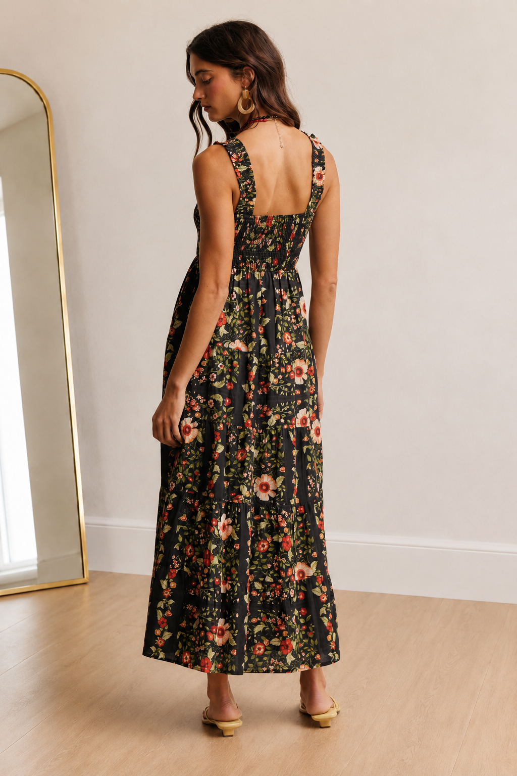 Back view of The Folk Tale cotton maxi dress with a square back and stretchy smocked bodice