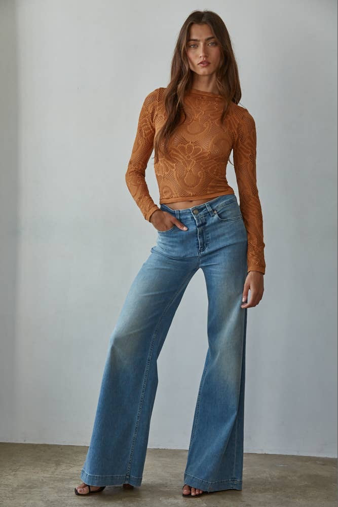 Romantic golden lace top with long sleeves styled casually for everyday wear