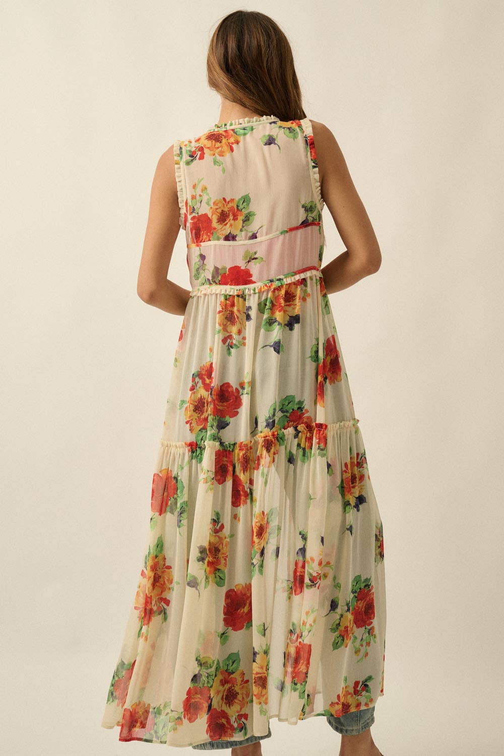 Woman wearing a floral dress with a plain background
