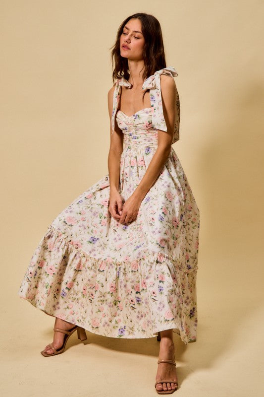 Woman wearing a floral dress against a beige background