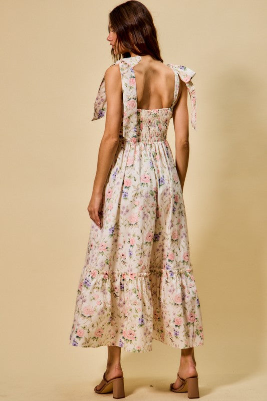 Back view of floral midi dress with smocked back
