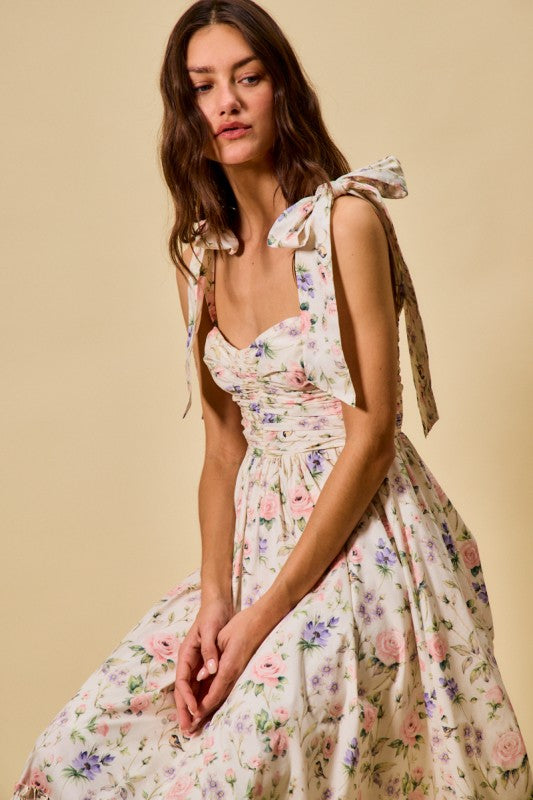 Woman wearing a floral dress with a beige background