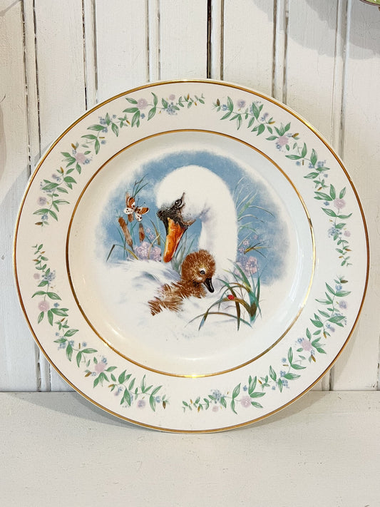 Vintage Avon swan and cygnet decorative plate with gold trim and floral vine border