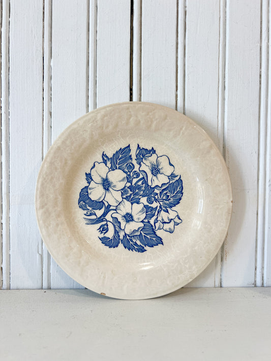 Vintage 7 inch blue and white floral ceramic plate with crackle glaze styled for FOUND & Co.