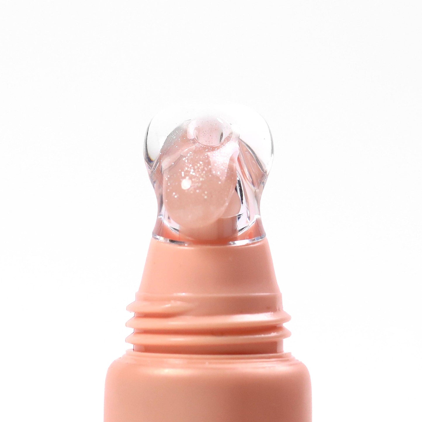 Lip balm with a transparent cap on a white background