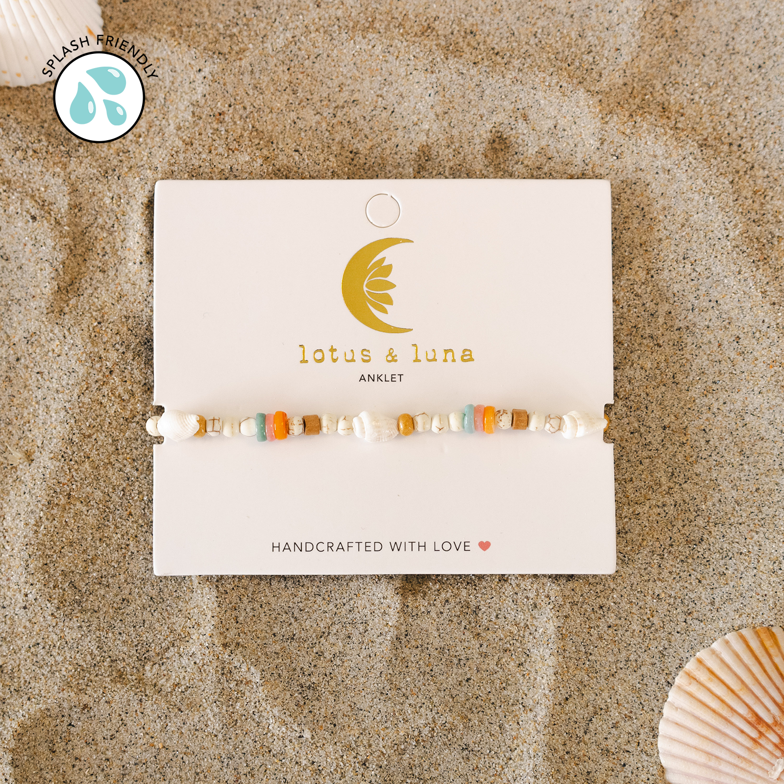 Lotus & Luna anklet on a branded card with a shell in the background