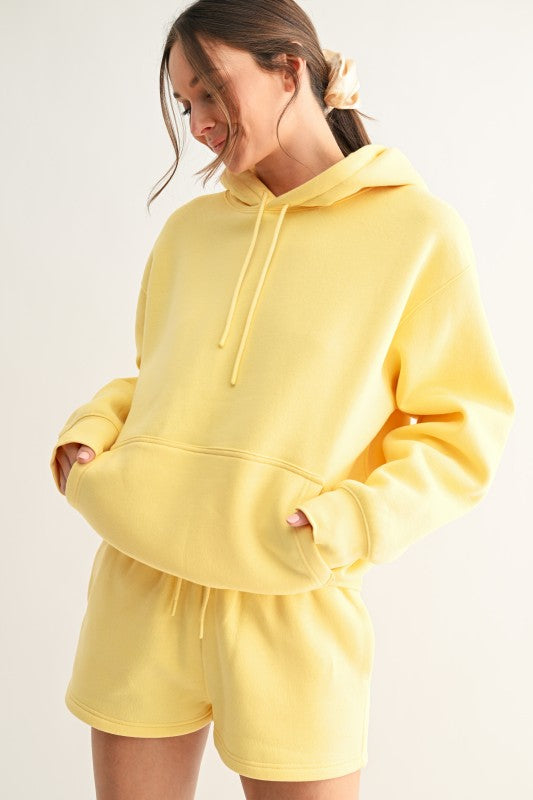 Soft oversized butter yellow hoodie with kangaroo pocket and hood