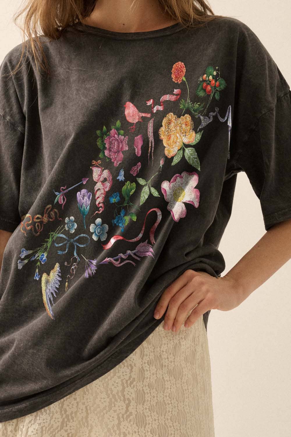 Dark gray sweatshirt with colorful floral graphic on a neutral background