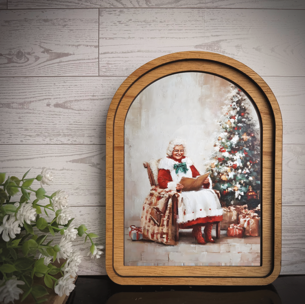 Maci Loo Makings - Arch Frame Art Mrs Claus Reading Book | Winter Wood & Canvas