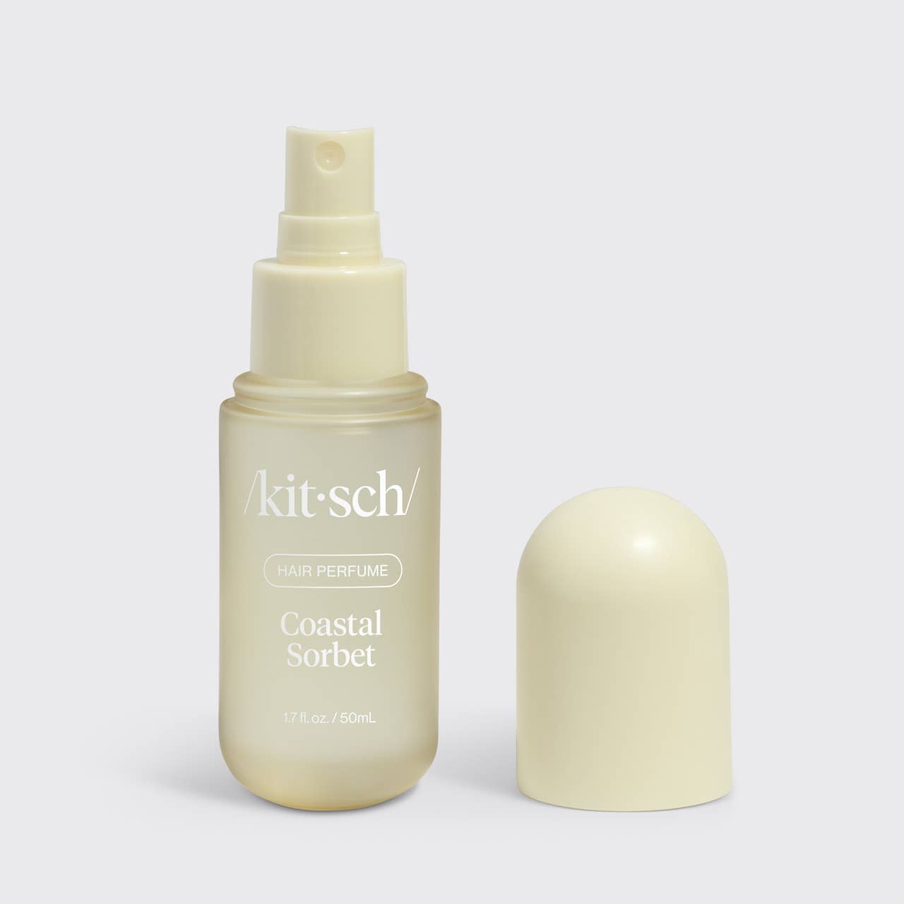 Kitsch Coastal Sorbet hair perfume bottle on a light gray background