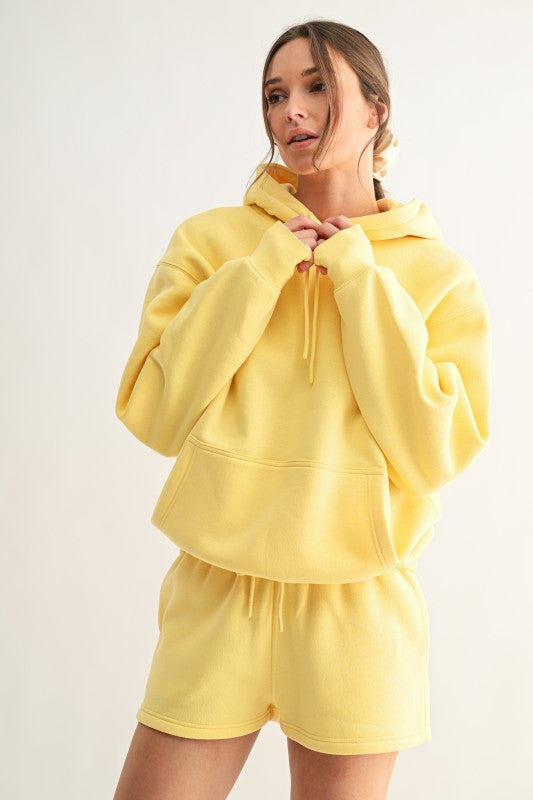 Muted yellow oversized fleece hoodie in Soft Butter