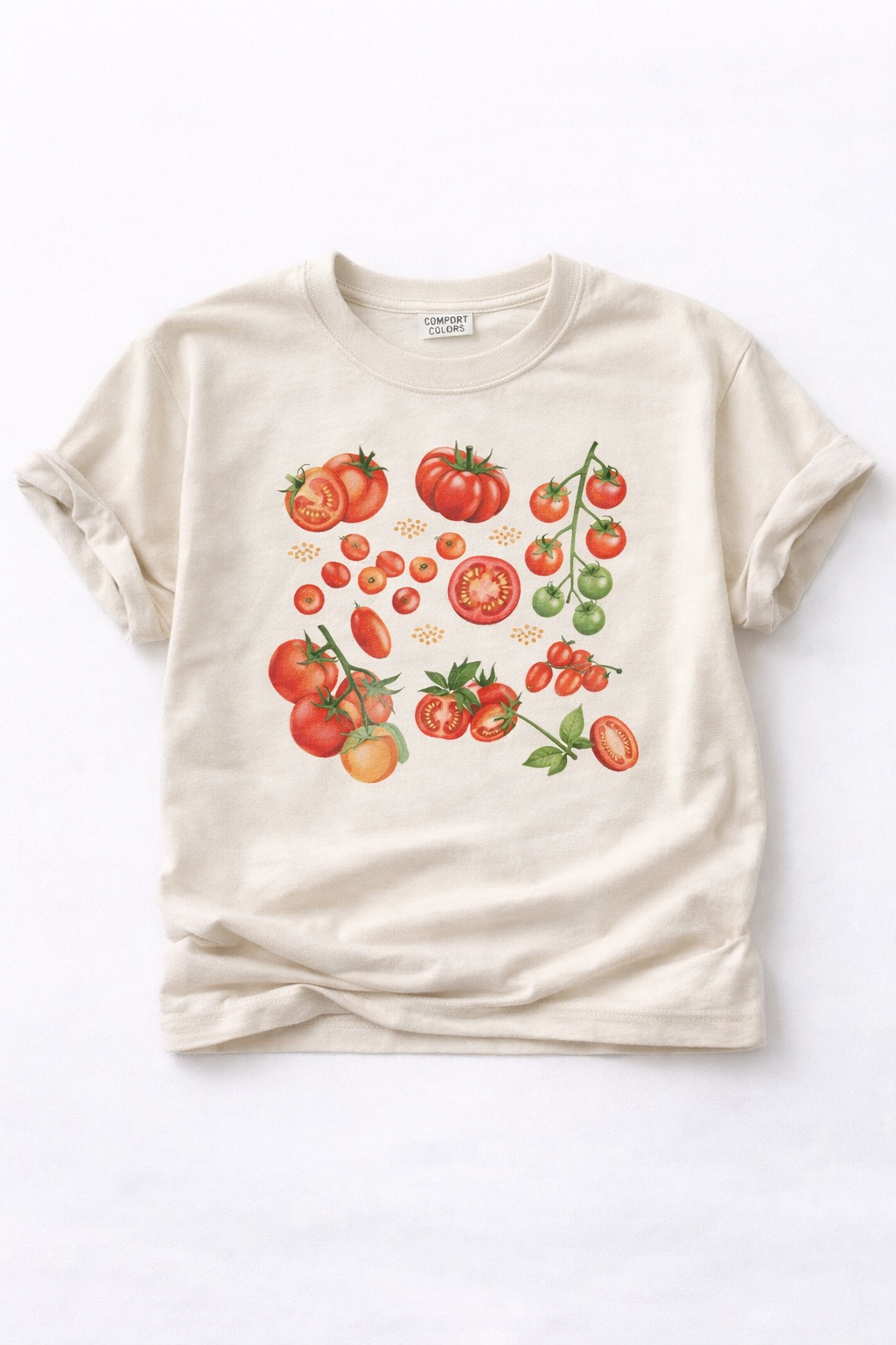 Beige t-shirt with tomato graphic on a white background