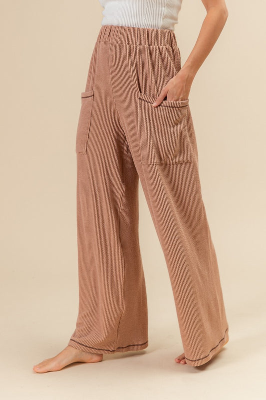 Cozy up in our Sunset Stroll Waffle Pants. These boho-chic wide-leg lounge pants feature soft waffle knit, oversized pockets, and a relaxed fit – perfect for cozy fall vibes.