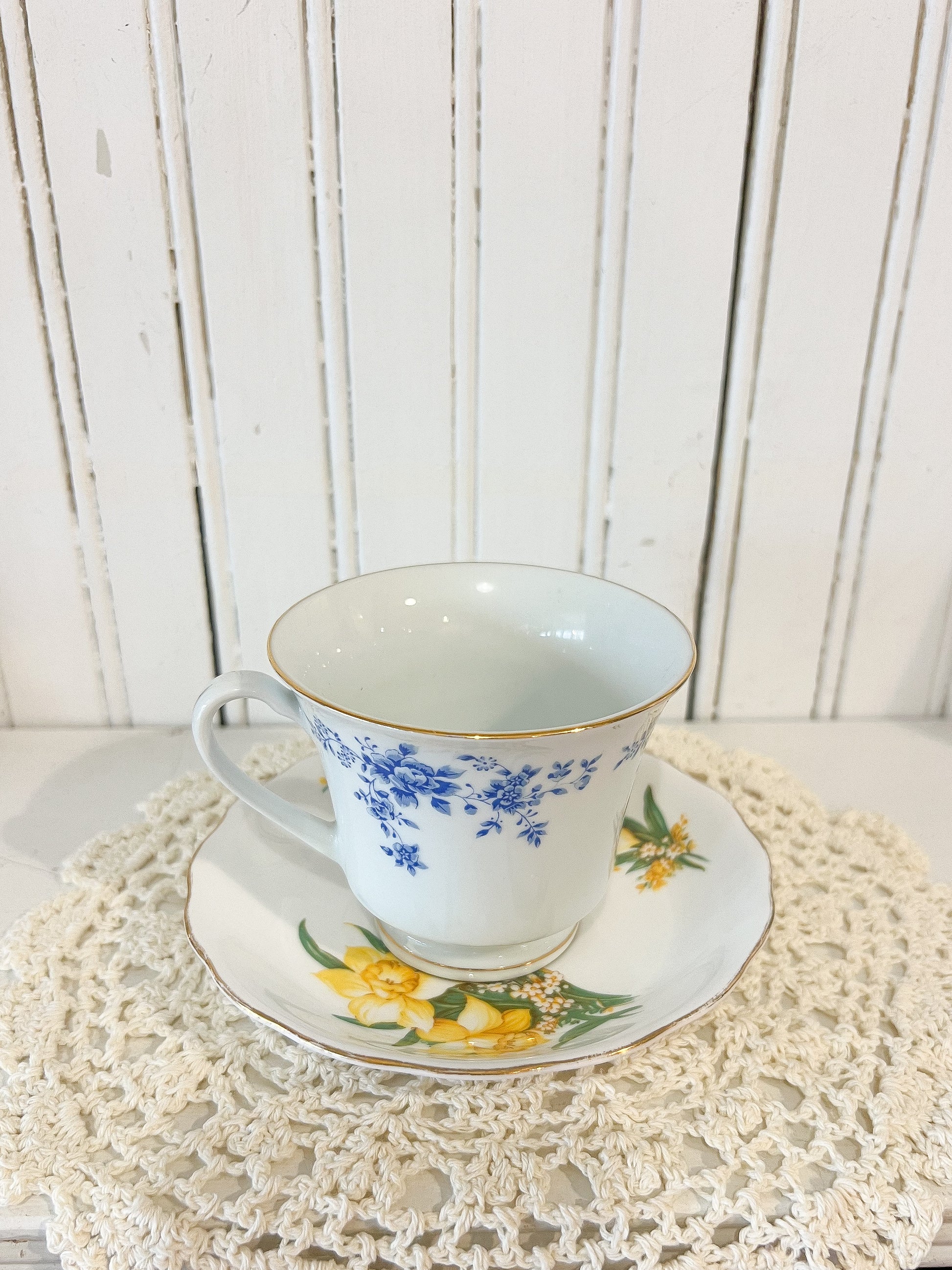 Vintage mix and match floral teacup and saucer with blue floral teacup and yellow daffodil saucer, cottage style tea set
