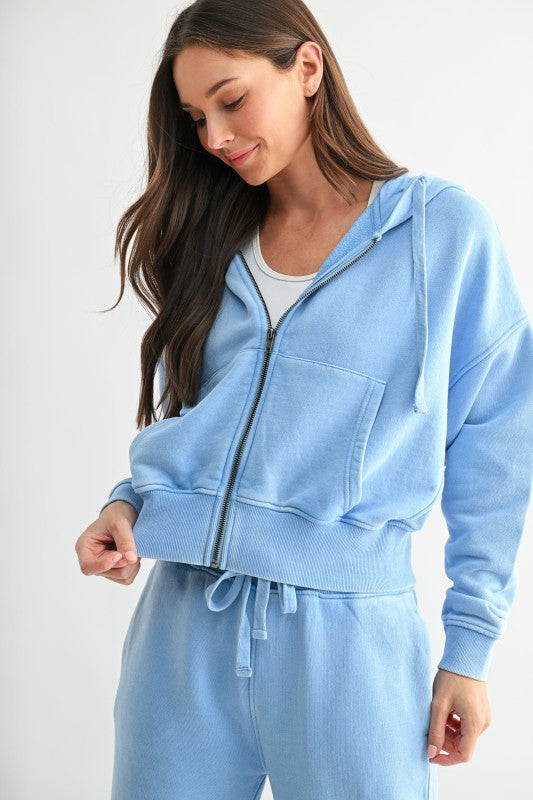 Soft sky blue zip-front hoodie with relaxed fit