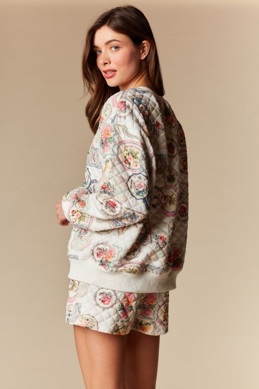 Woman wearing a floral pajama set against a beige background