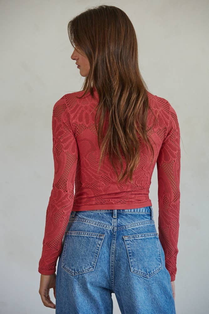 Romantic crimson lace top with long sleeves styled casually for everyday wear