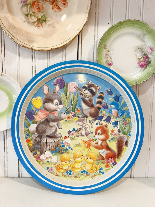 Vintage metal serving tray with bunny, raccoon, squirrel and chicks in colorful spring flowers, retro Easter animal tray with blue rim