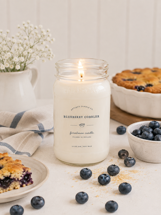 Antique Candle Co. Blueberry Cobbler soy candle in a reusable glass jar with sweet blueberry, buttery pastry, cinnamon, and vanilla fragrance.