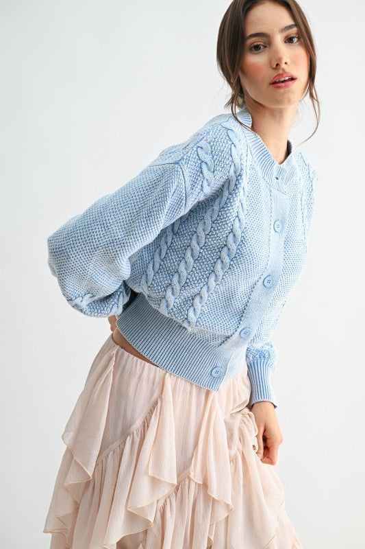Cropped blue knit cardigan with ribbed hem