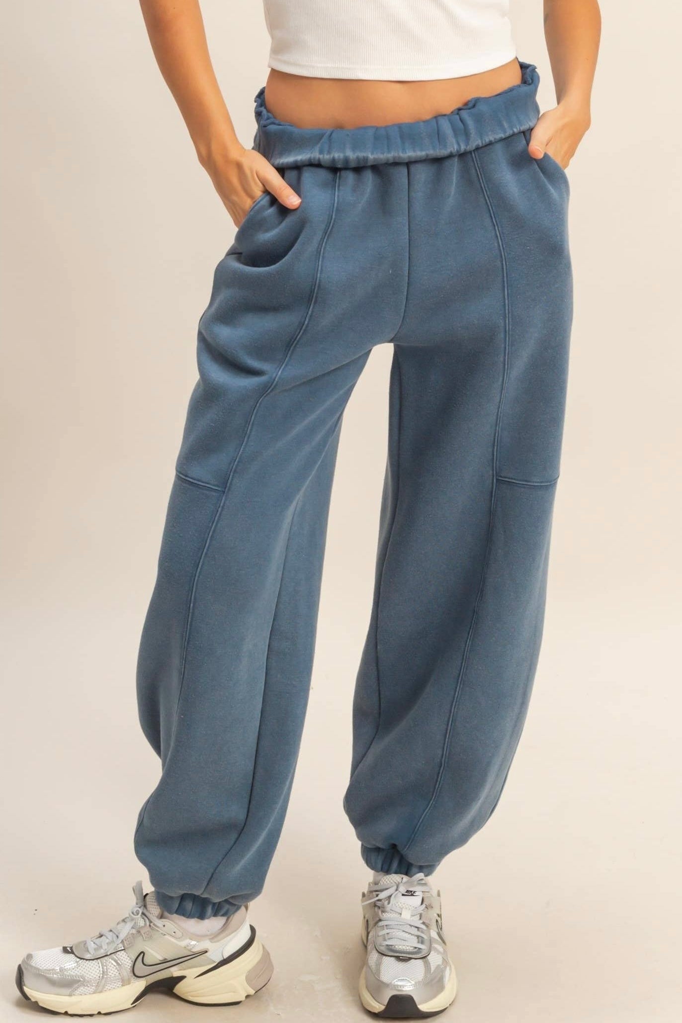 Snow-washed wide-leg comfort joggers in Blue Frost. Vintage-faded finish, cinched ankles, fleece interior, and relaxed silhouette for cozy winter style.