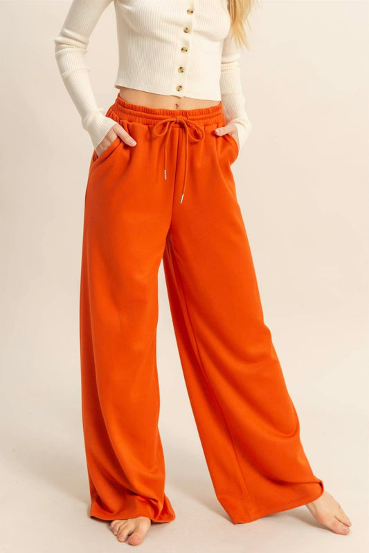 orange wide leg lounge pants on model – cozy women’s loungewear