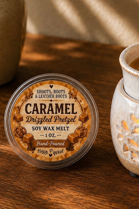 Caramel Drizzled Pretzel hand-poured soy wax melt beside a ceramic wax warmer.