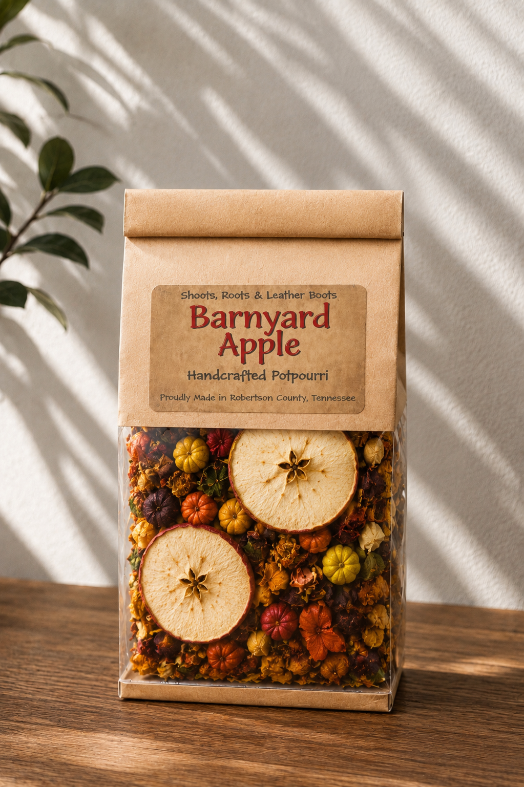Barnyard Apple handcrafted potpourri in a kraft bag with dried apple slices and colorful botanicals