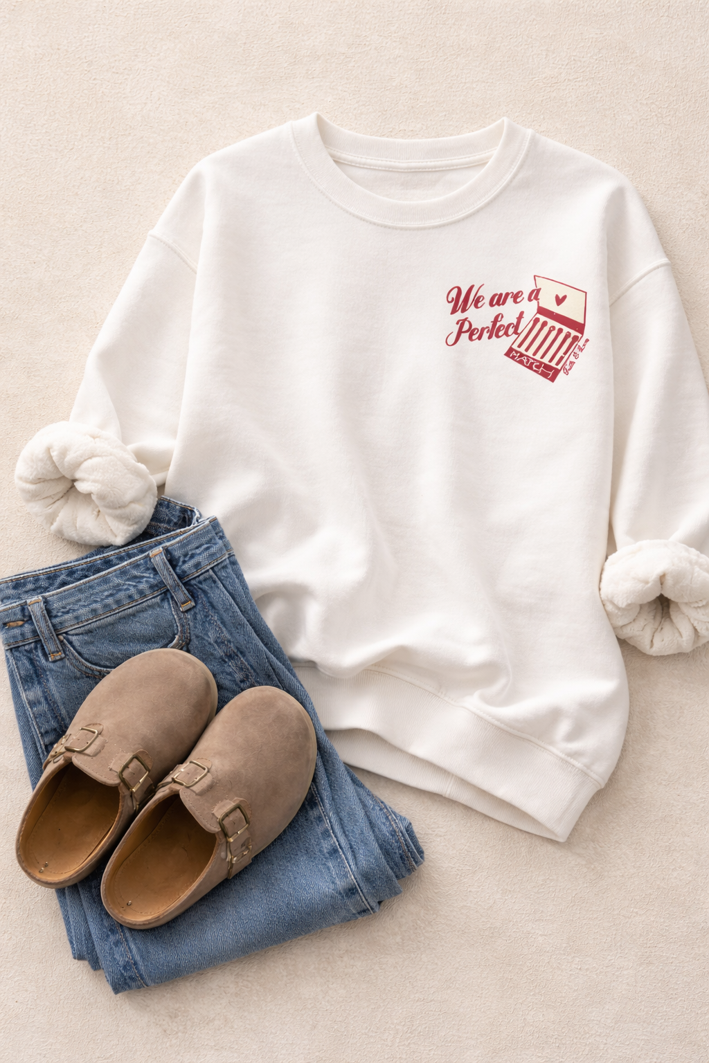 Cream cozy crewneck sweatshirt with small “Perfect Match” graphic on front