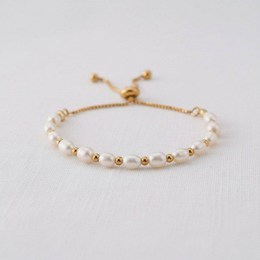 Freshwater pearl bracelet with gold bead accents and adjustable sliding clasp
