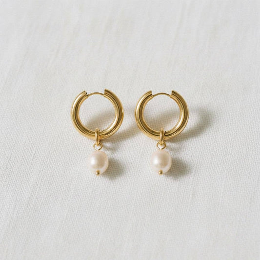 Gold hoop earrings with freshwater pearl drop accents