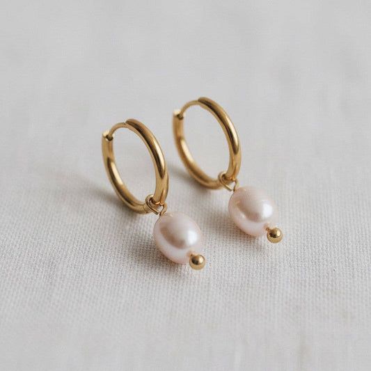 Gold hoop earrings with freshwater pearl drop accents