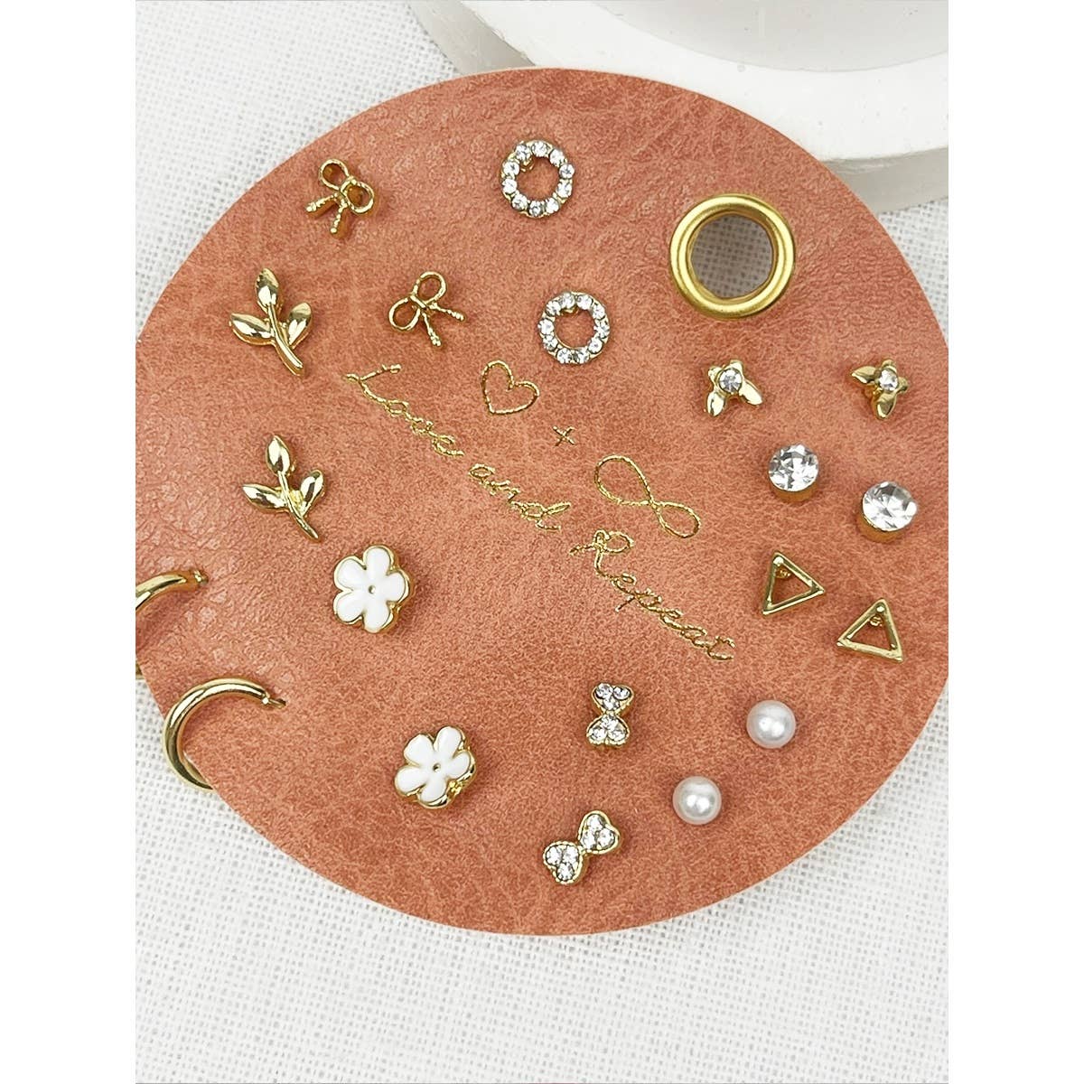 Mixed gold stud earring collection with nine pairs of dainty earrings
