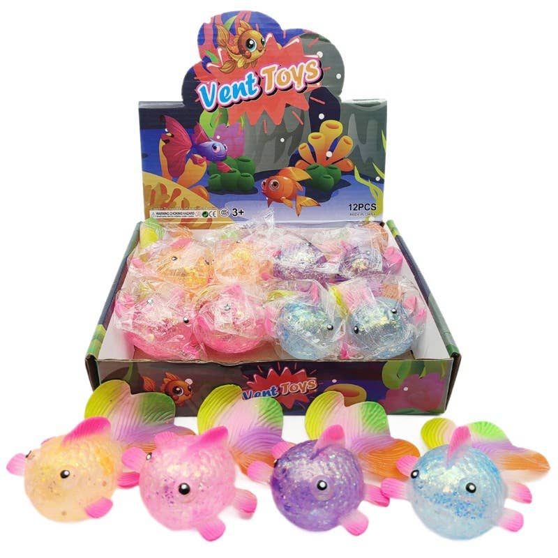 Box of squishie Toys with colorful squishy fish on a white background