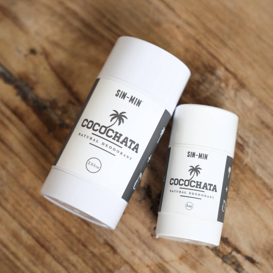SIN-MIN Cocochata aluminum-free natural deodorant in full and travel size on wood surface
