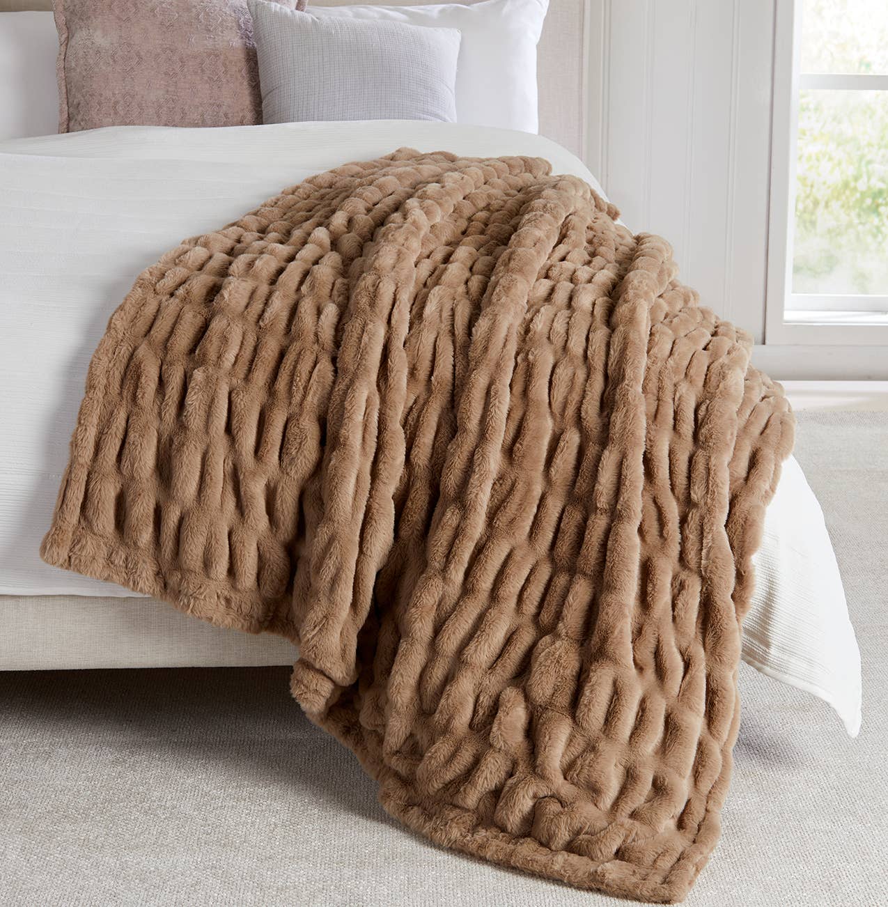 Neutral sand-colored plush throw with sculpted texture. Soft, luxurious, and perfect for cozy homes and holiday gifting.