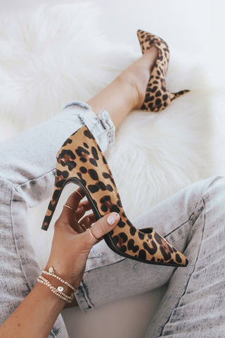 Leopard high heel pumps.