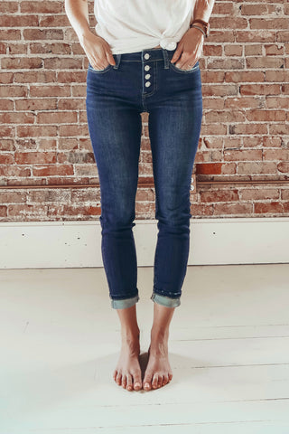The Flying Monkey Amber Button Fly Mid-Rise Ankle Skinny Jean.  A classic clean skinny cut.  Slightly frayed pockets on front and back. 